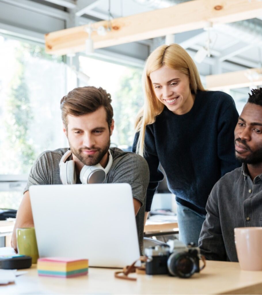 happy colleagues sitting in office coworking PHYA6TG 1970x2216 1 910x1024 - در طراحی سایت باید به چه نکاتی توجه کنیم ؟